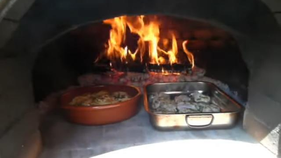 Conejo al ajillo horno leña